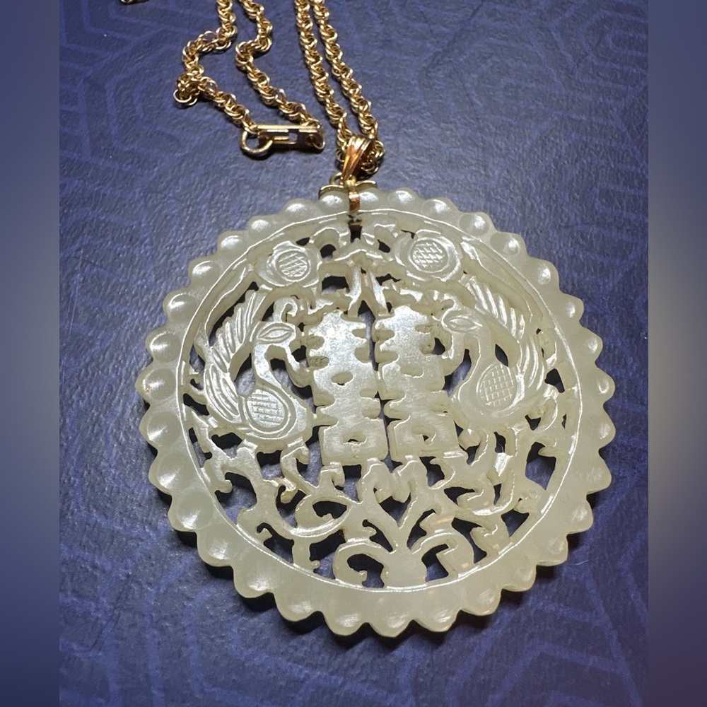 Carved Jade Pendant with 14k gold rope chain.